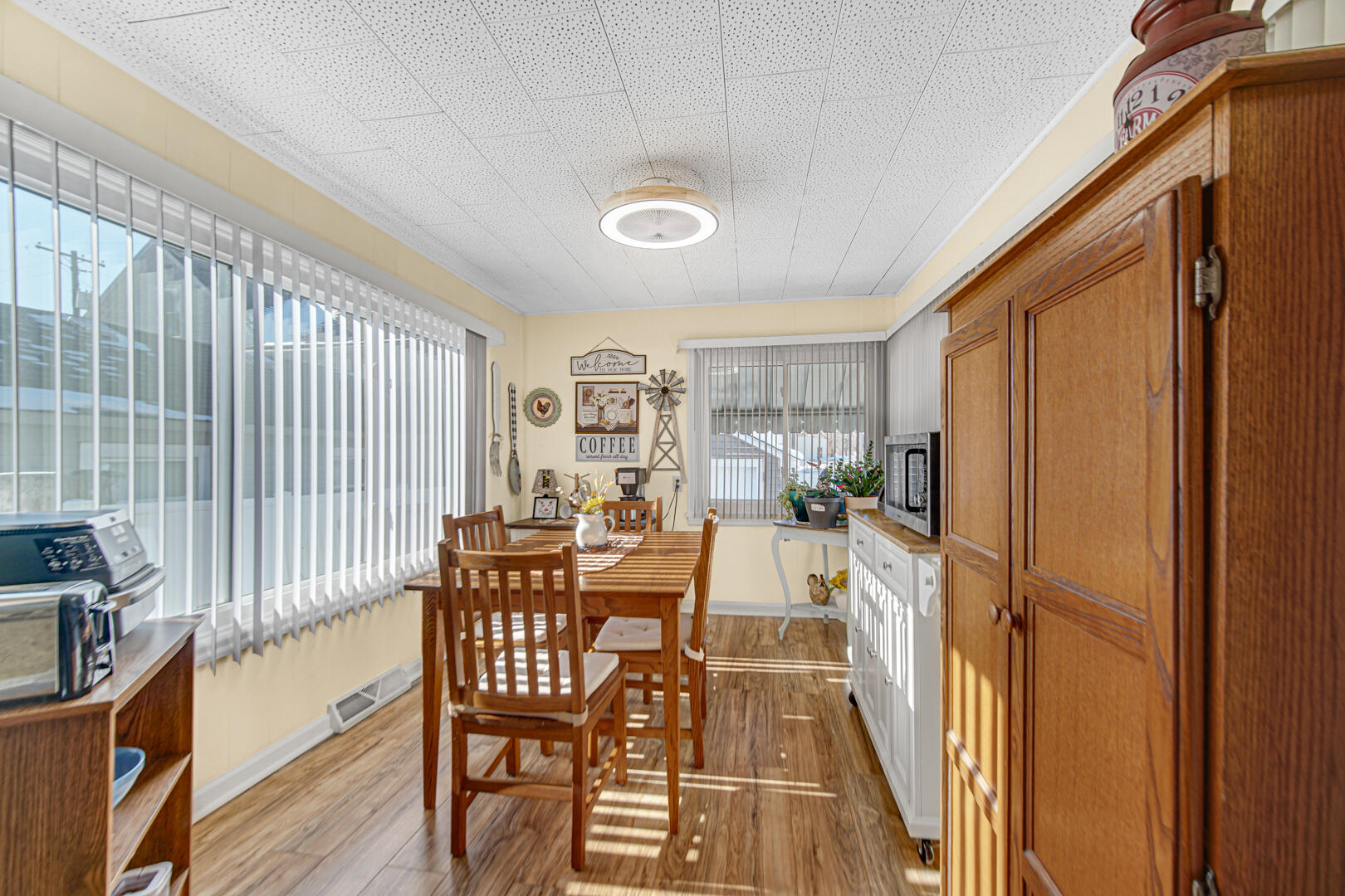 10 North Michigan Street La Crosse, IN 46348 - Photo 11 of 21 a view of a dining room with furniture window and wooden floor