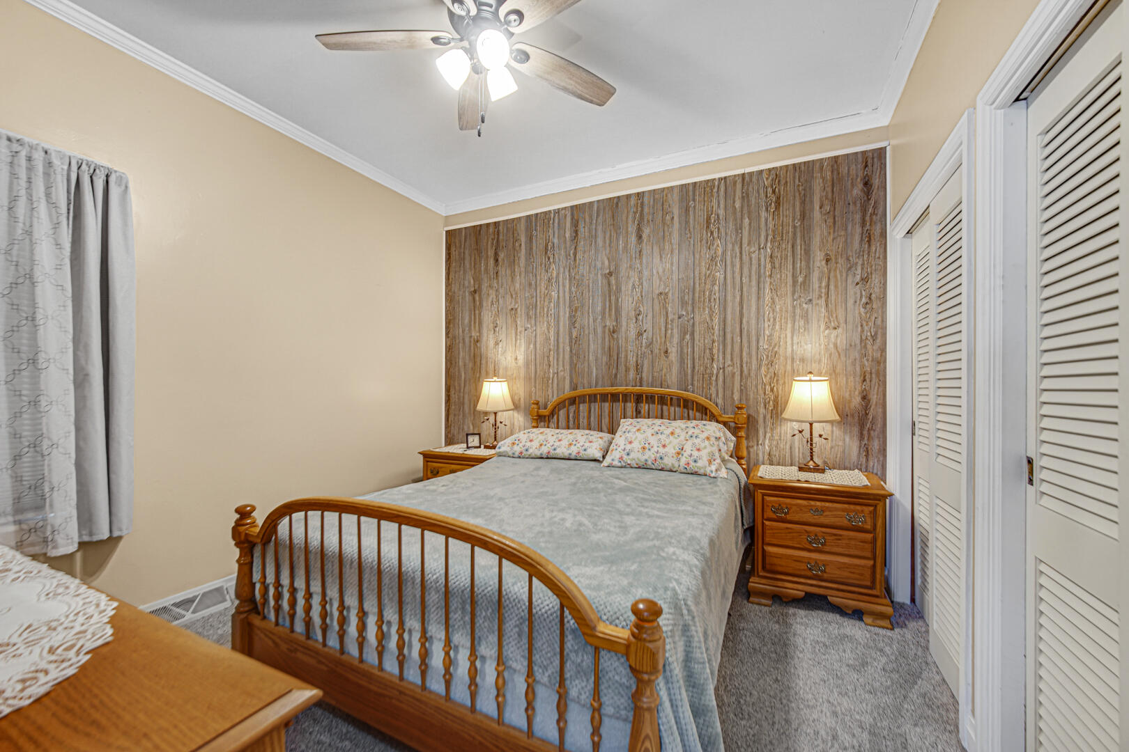 10 North Michigan Street La Crosse, IN 46348 - Photo 14 of 21 a bedroom with a bed and a chandelier