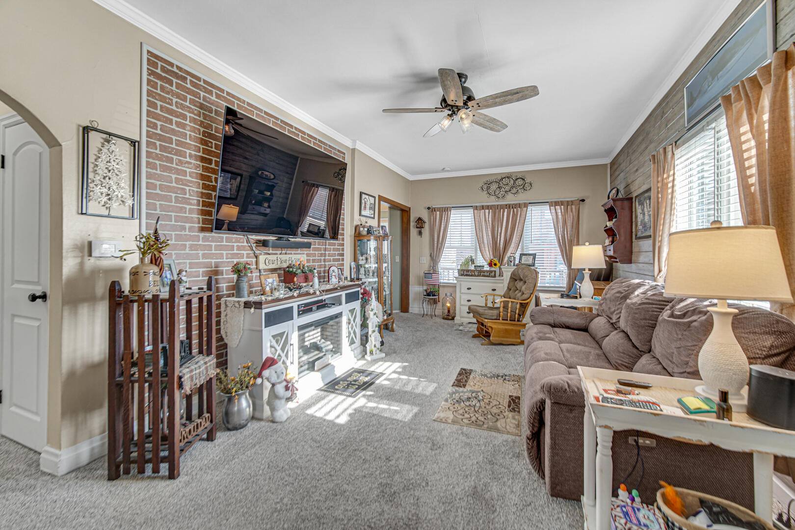 10 North Michigan Street La Crosse, IN 46348 - Photo 7 of 21 a living room with furniture and a flat screen tv
