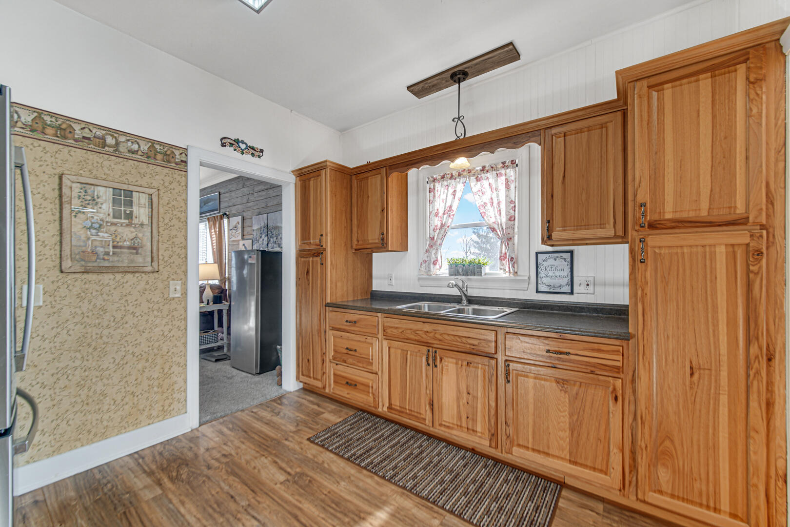 10 North Michigan Street La Crosse, IN 46348 - Photo 9 of 21 a kitchen with stainless steel appliances granite countertop a refrigerator a sink and dishwasher