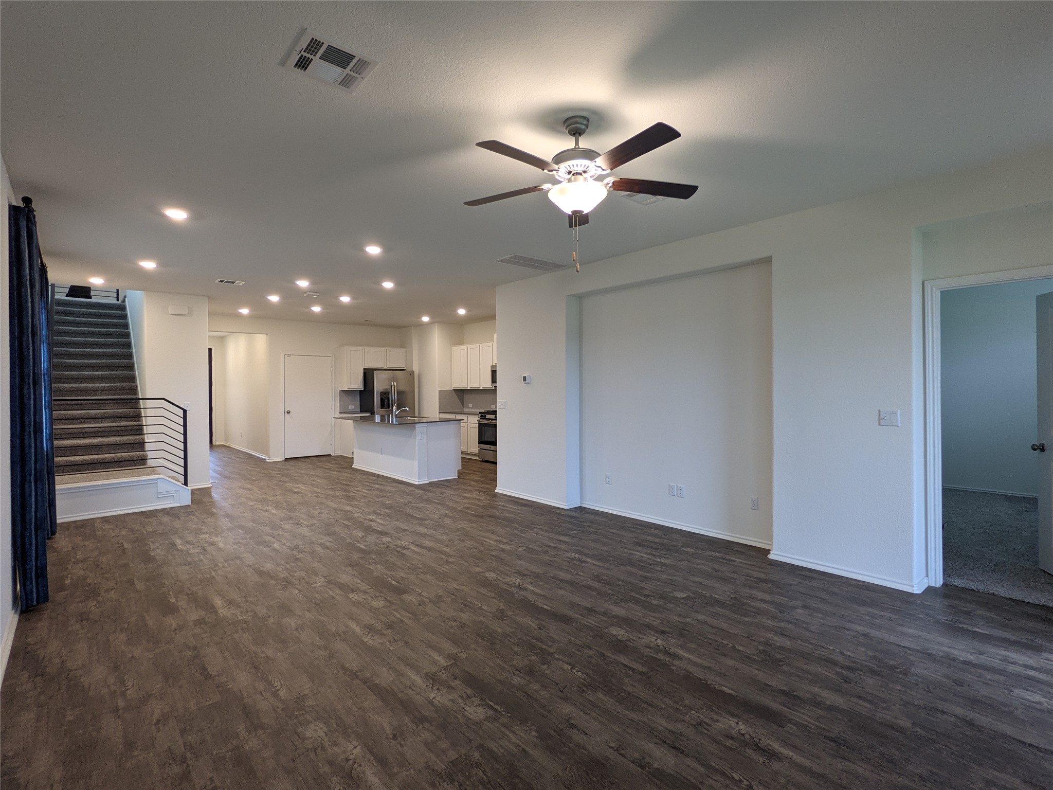 100 Montauk Loop Georgetown, TX 78628 - Photo 21 of 21 An open floor plan with rich wood-tone flooring offers seamless living and dining space.