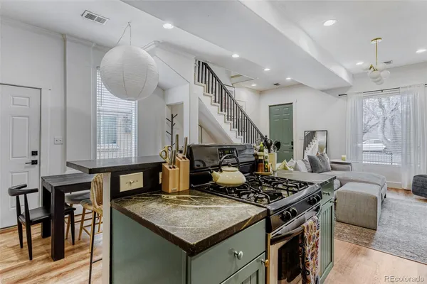 a kitchen with a stove and a table