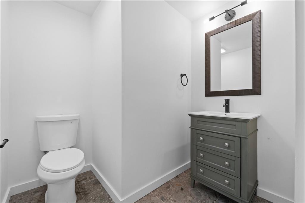 566 Kelso Road Pittsburgh, PA 15243 - Photo 17 of 40 a bathroom with a toilet a sink and mirror