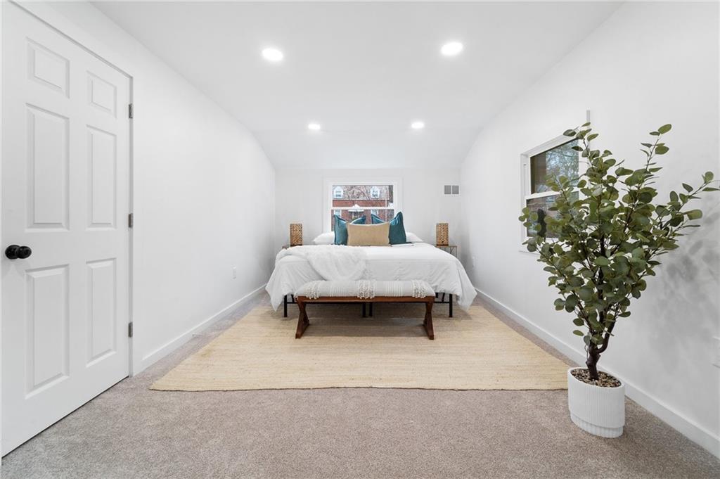 566 Kelso Road Pittsburgh, PA 15243 - Photo 25 of 40 a bedroom with a bed and a potted plant