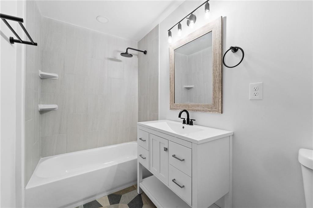 566 Kelso Road Pittsburgh, PA 15243 - Photo 36 of 40 a bathroom with a sink a toilet and bathtub