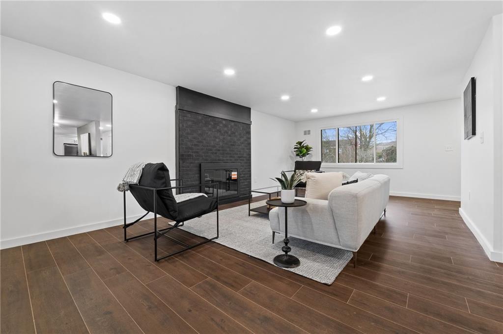 566 Kelso Road Pittsburgh, PA 15243 - Photo 8 of 40 a living room with furniture a wooden floor and a potted plant