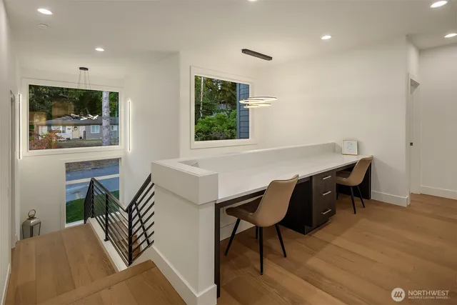 a view of a dining room with furniture window and wooden floor