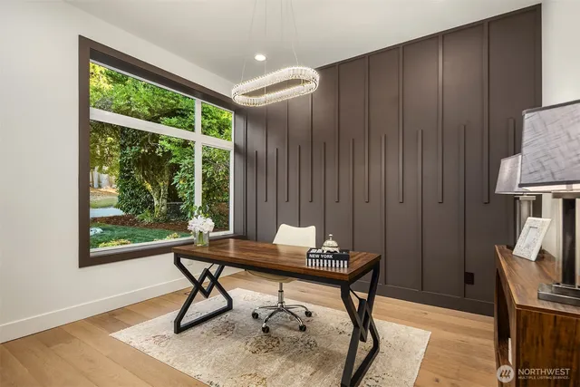 a work room with furniture and a window