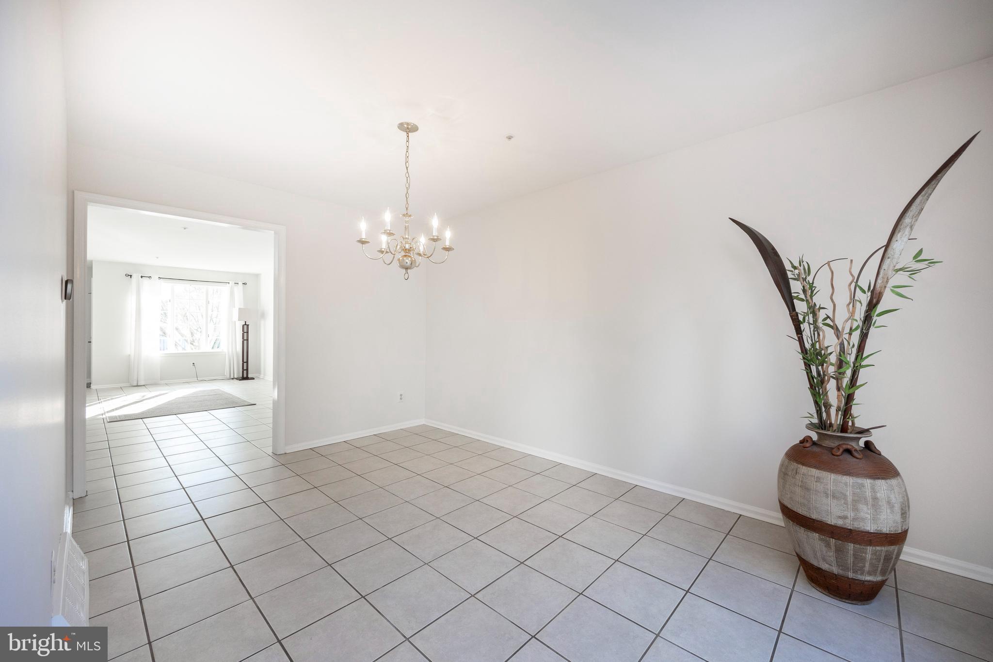 521 Pewter Drive Exton, PA 19341 - Photo 11 of 52 a view of a room with a chandelier fan and carpet