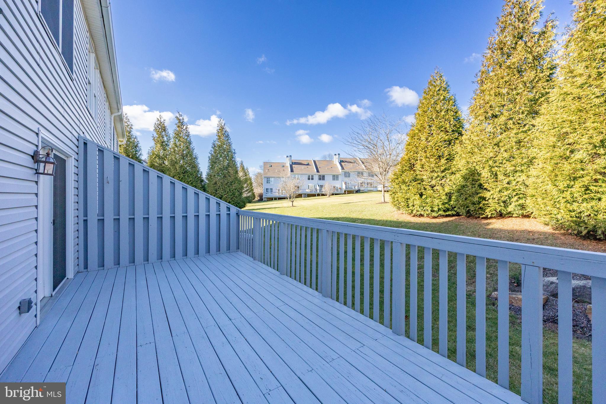521 Pewter Drive Exton, PA 19341 - Photo 12 of 52 a balcony with wooden floor and yard in the back