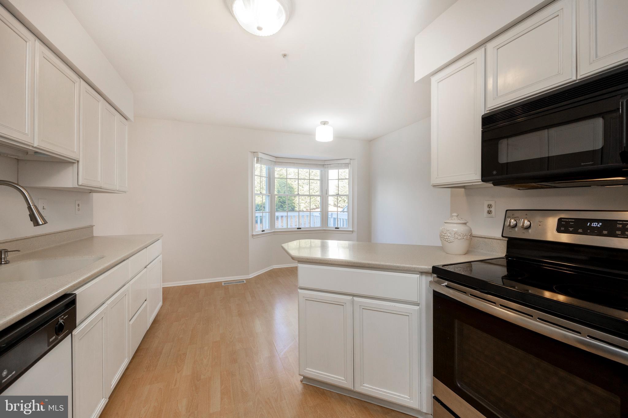 521 Pewter Drive Exton, PA 19341 - Photo 15 of 52 a kitchen with a sink stove and microwave