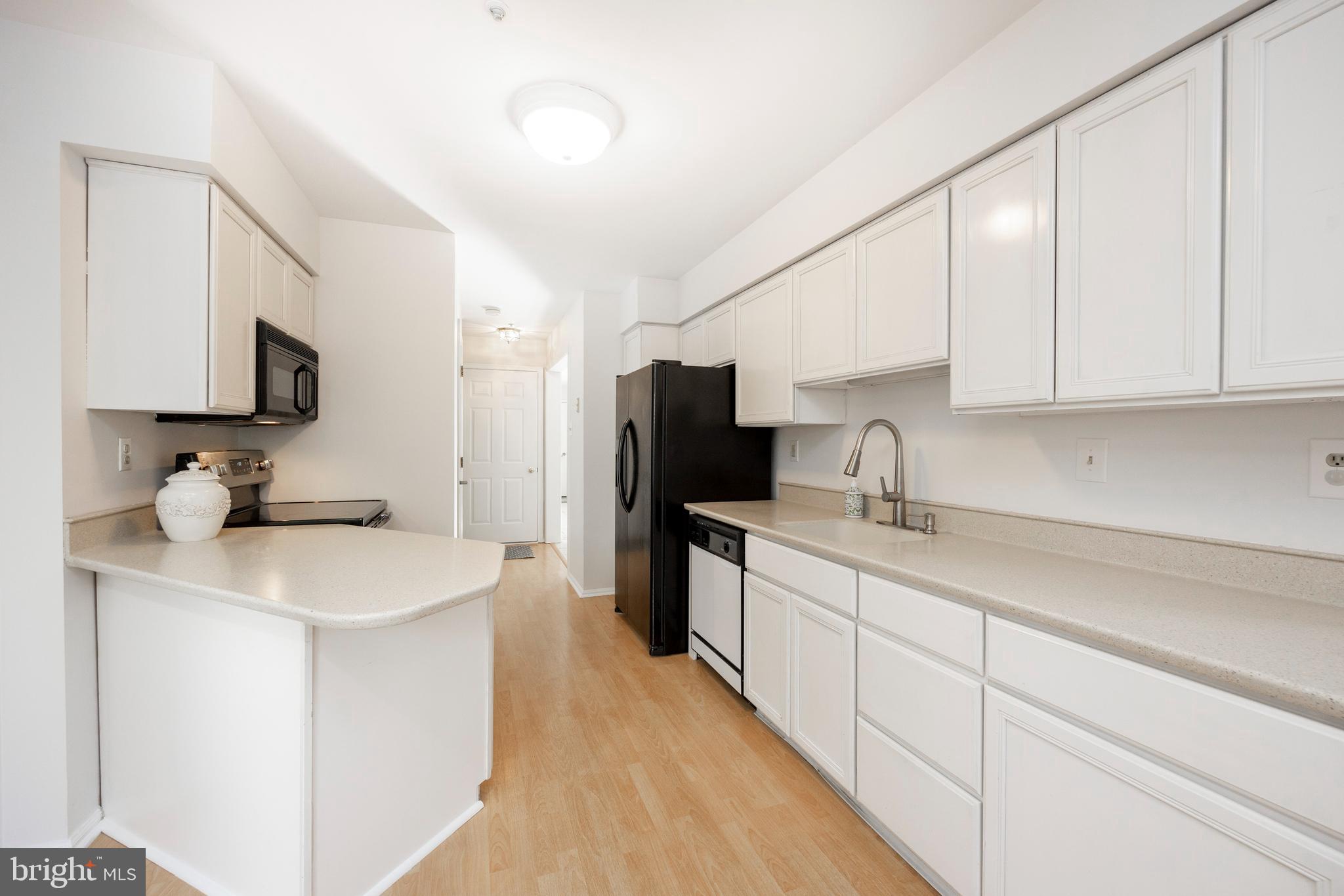 521 Pewter Drive Exton, PA 19341 - Photo 17 of 52 a kitchen with a sink stove and refrigerator