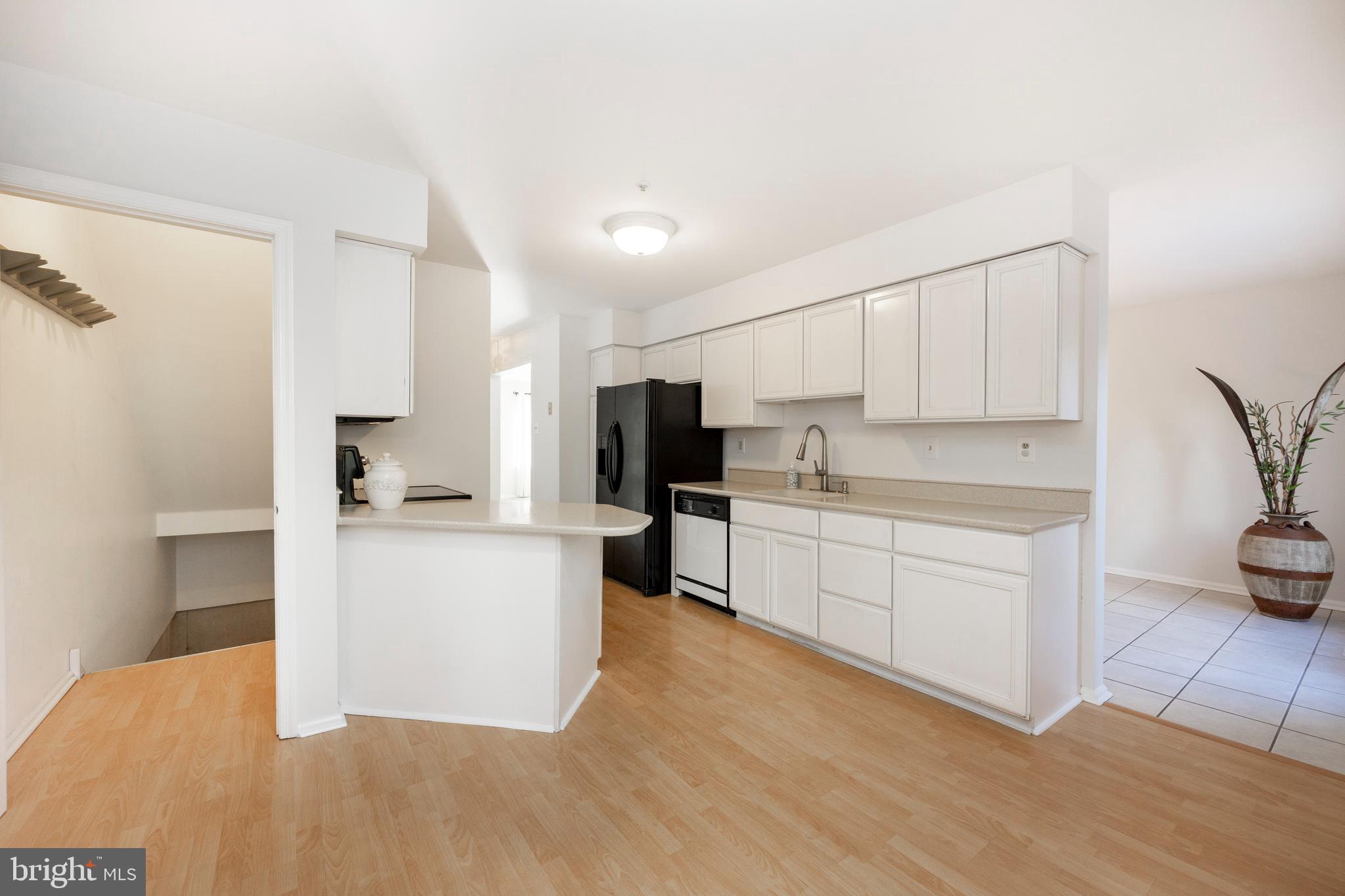 521 Pewter Drive Exton, PA 19341 - Photo 18 of 52 a kitchen with white cabinets and appliances