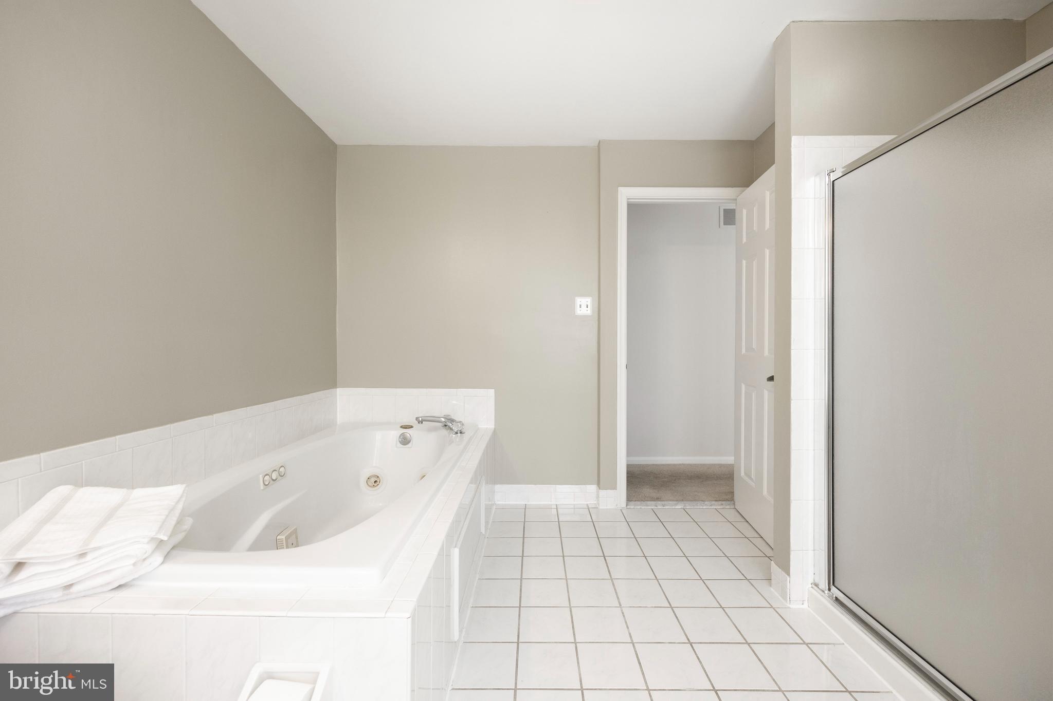 521 Pewter Drive Exton, PA 19341 - Photo 25 of 52 a bathroom with a bathtub and shower