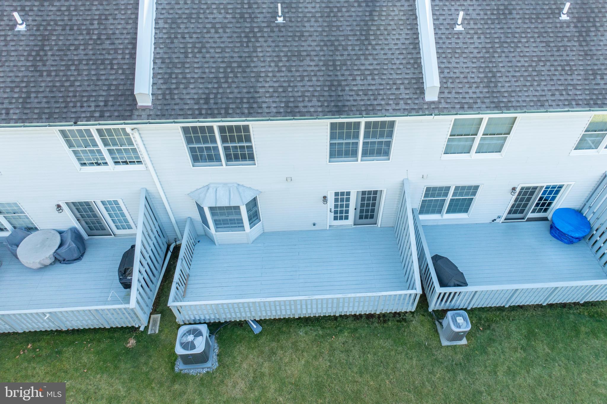 521 Pewter Drive Exton, PA 19341 - Photo 44 of 52 a view of a backyard with chairs and a table