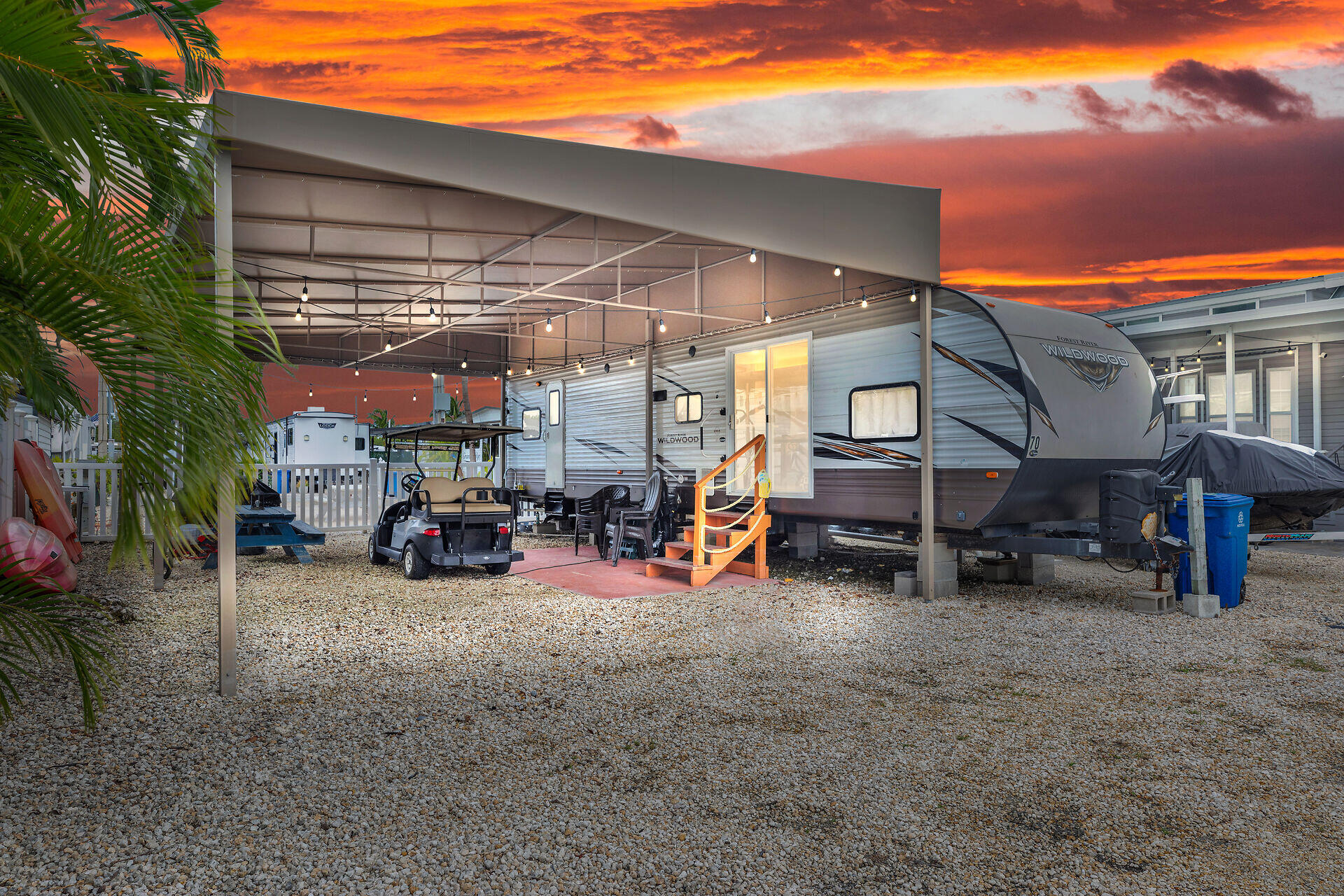 325 Calusa Street, Unit 70 Key Largo, FL 33037 - Photo 1 of 32 a view of a garage with parked cars