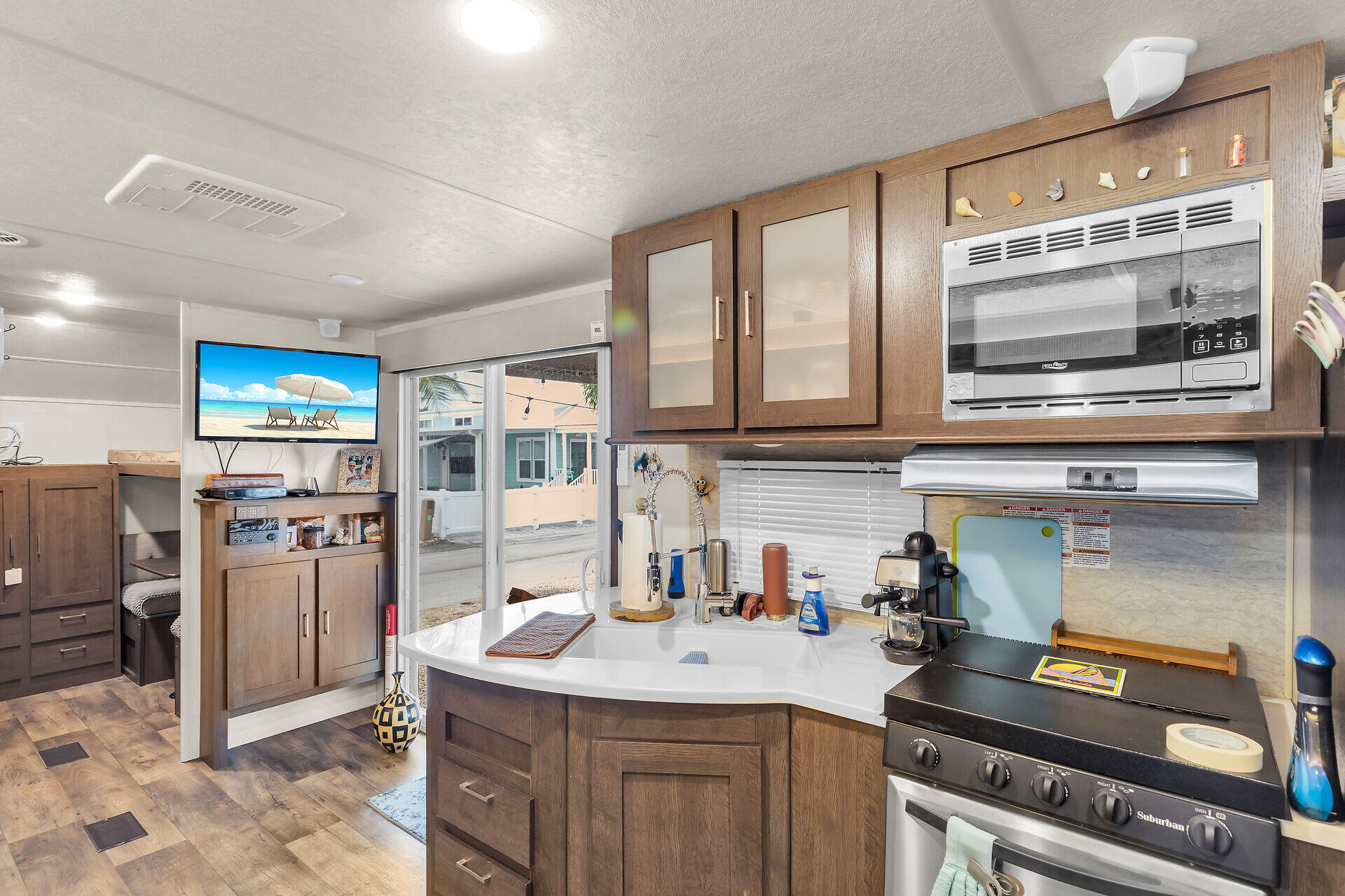 325 Calusa Street, Unit 70 Key Largo, FL 33037 - Photo 18 of 32 a kitchen with stainless steel appliances granite countertop a stove and a refrigerator