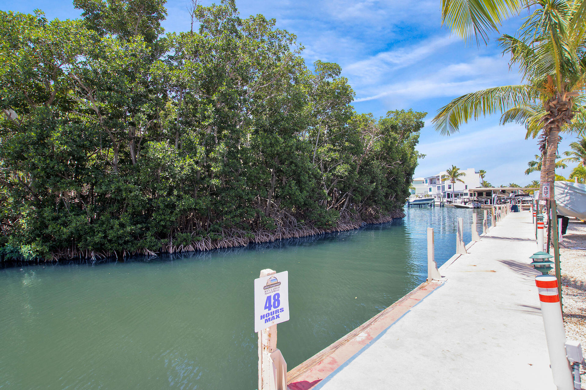 325 Calusa Street, Unit 70 Key Largo, FL 33037 - Photo 20 of 32 a view of a lake with houses