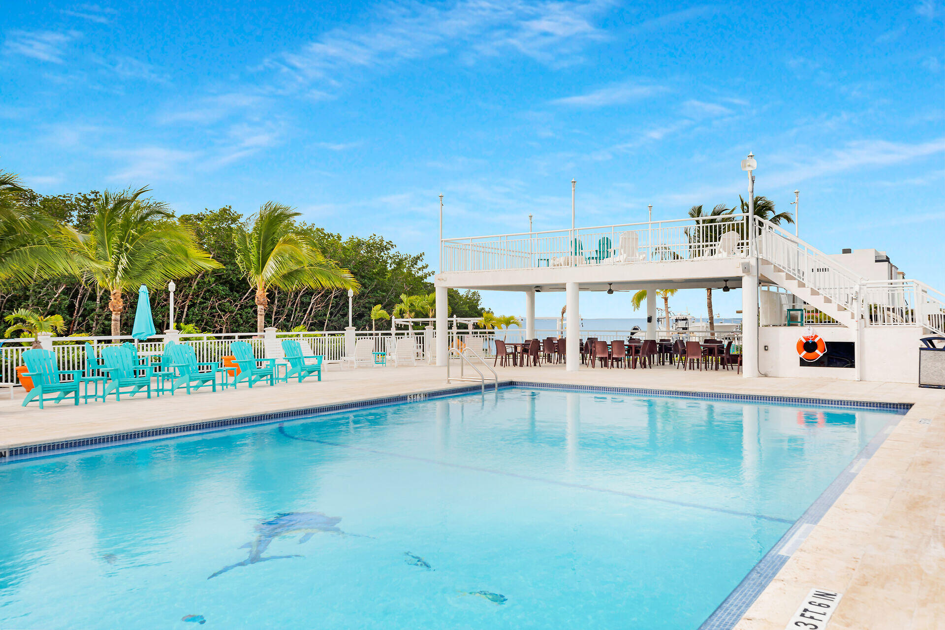 325 Calusa Street, Unit 70 Key Largo, FL 33037 - Photo 24 of 32 a view of a swimming pool with a patio