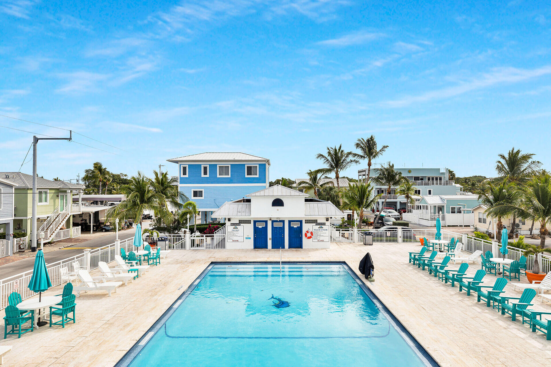 325 Calusa Street, Unit 70 Key Largo, FL 33037 - Photo 25 of 32 a view of a swimming pool with outdoor seating