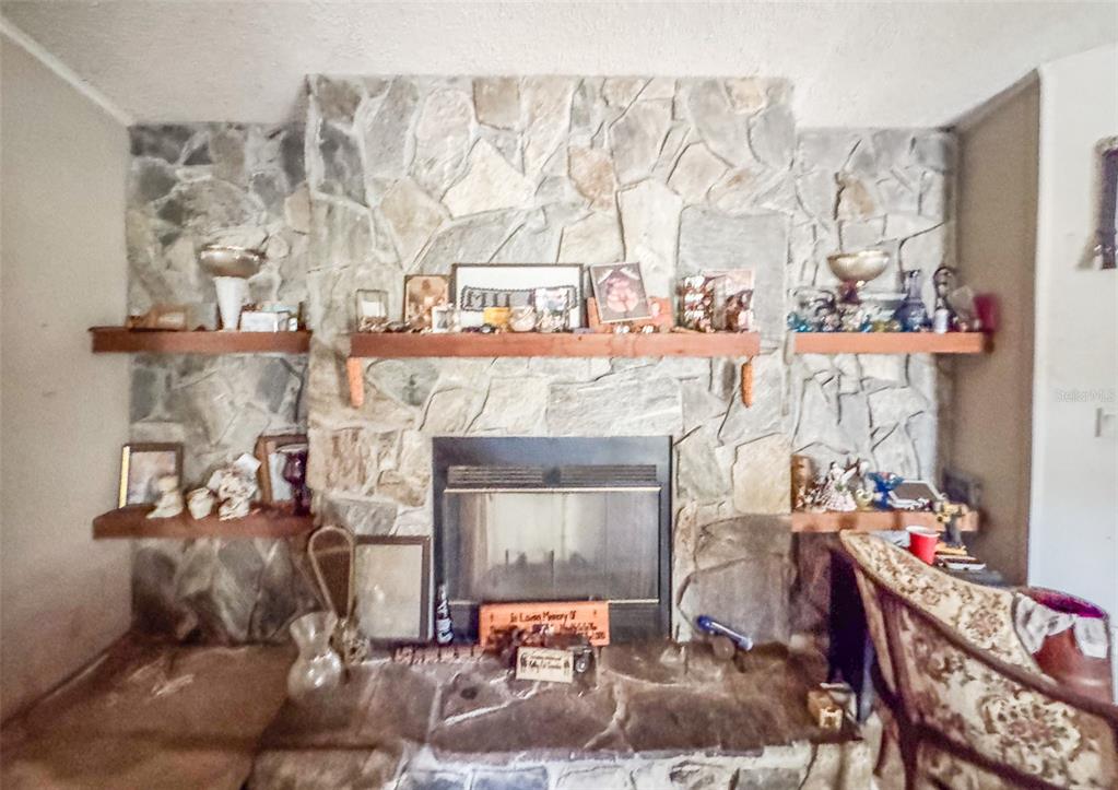 5013 Greenbriar Road Lakeland, FL 33810 - Photo 27 of 34 a building with glass top table and chairs