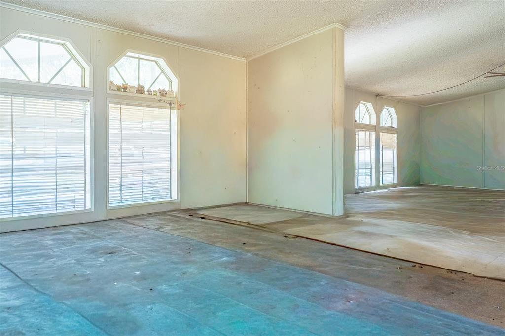 5013 Greenbriar Road Lakeland, FL 33810 - Photo 28 of 34 an empty room with large windows