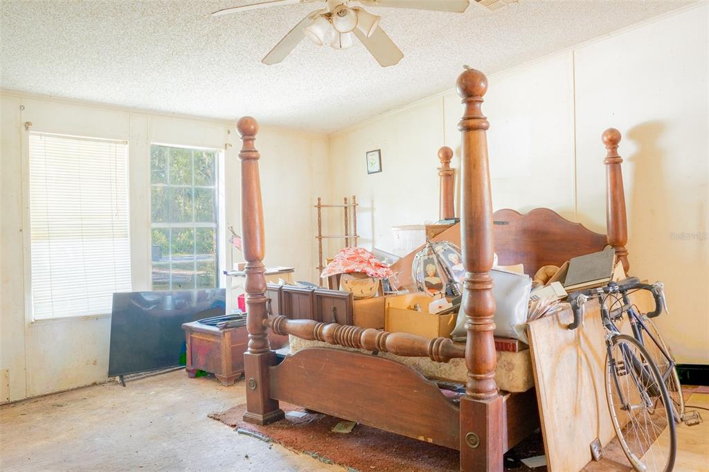 5013 Greenbriar Road Lakeland, FL 33810 - Photo 32 of 34 a living room with furniture and large windows