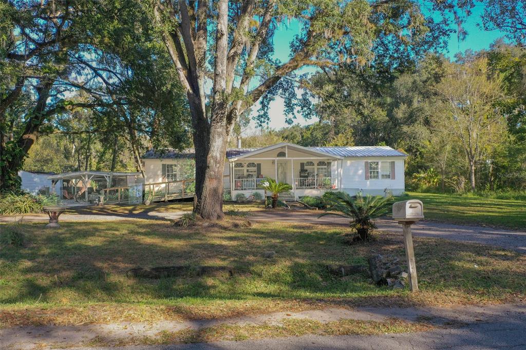 5013 Greenbriar Road Lakeland, FL 33810 - Photo 5 of 34 a front view of a house with garden