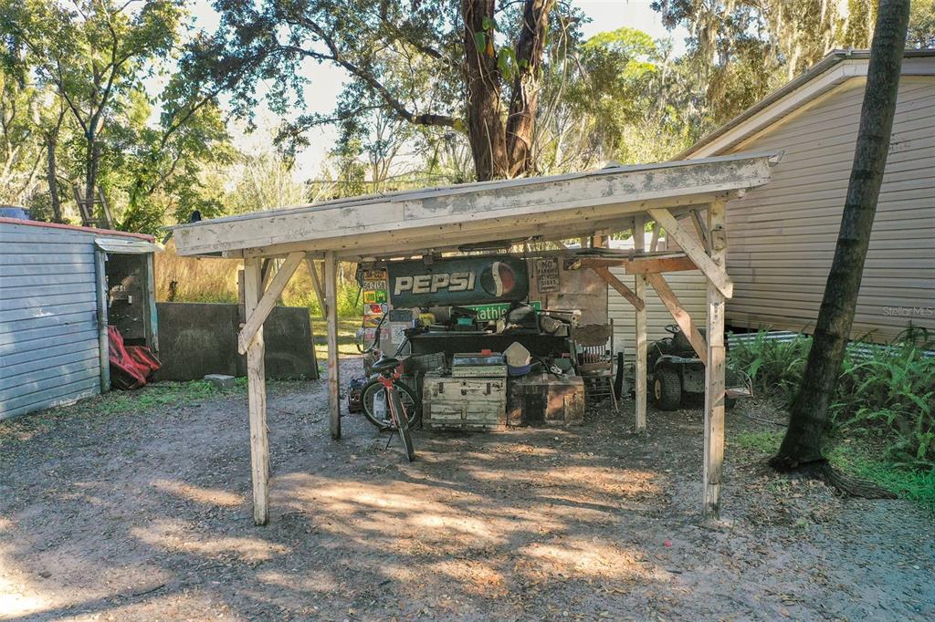 5013 Greenbriar Road Lakeland, FL 33810 - Photo 8 of 34 a view of a porch with a table and chairs