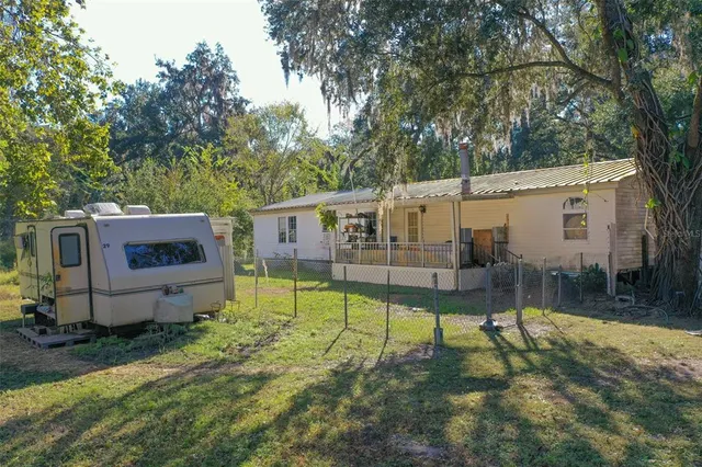 a view of a backyard with a garden and plants