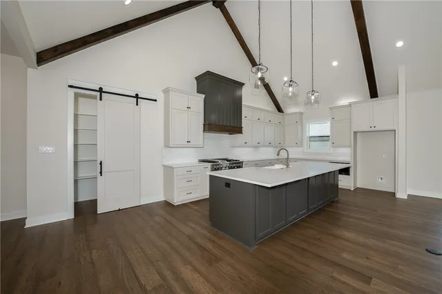 a kitchen with a sink and a refrigerator
