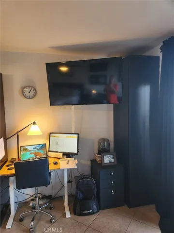 a living room with a couch and a flat screen tv