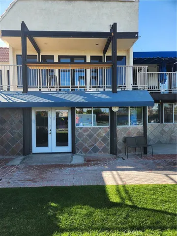 a view of a house with pool and porch