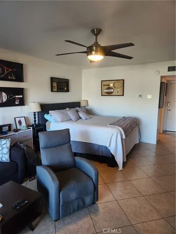 a bedroom with a bed and a couch