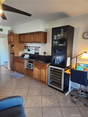 a kitchen with stainless steel appliances a stove a sink and a refrigerator