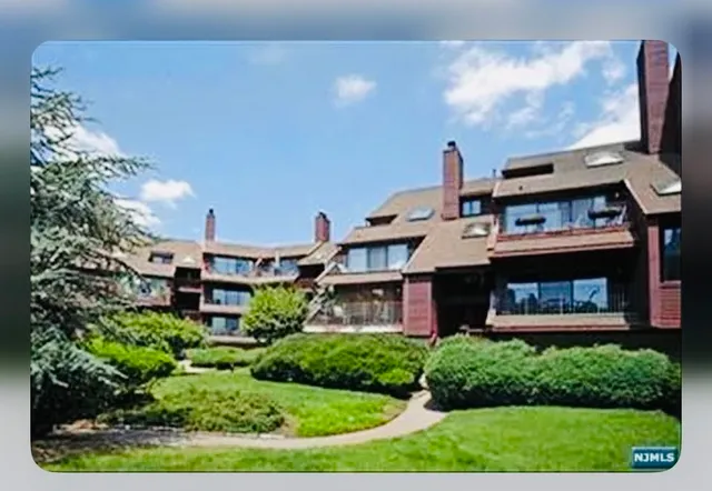 a aerial view of a house with a yard
