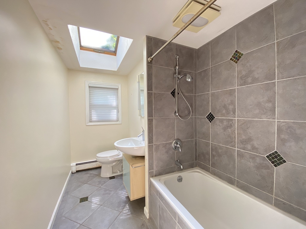 13 Oxbow Road Natick, MA 01760 - Photo 11 of 21 a bathroom with a sink a toilet and shower