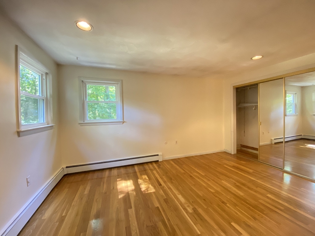 13 Oxbow Road Natick, MA 01760 - Photo 15 of 21 a view of empty room with wooden floor and fan