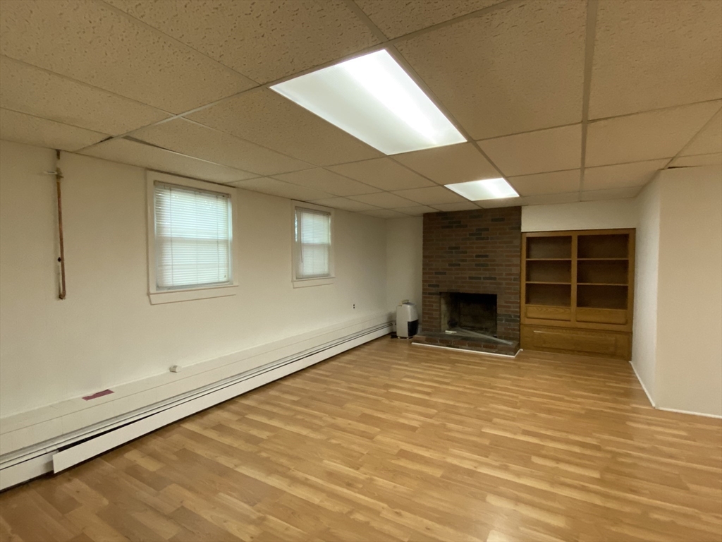 13 Oxbow Road Natick, MA 01760 - Photo 18 of 21 a view of a livingroom with a fireplace