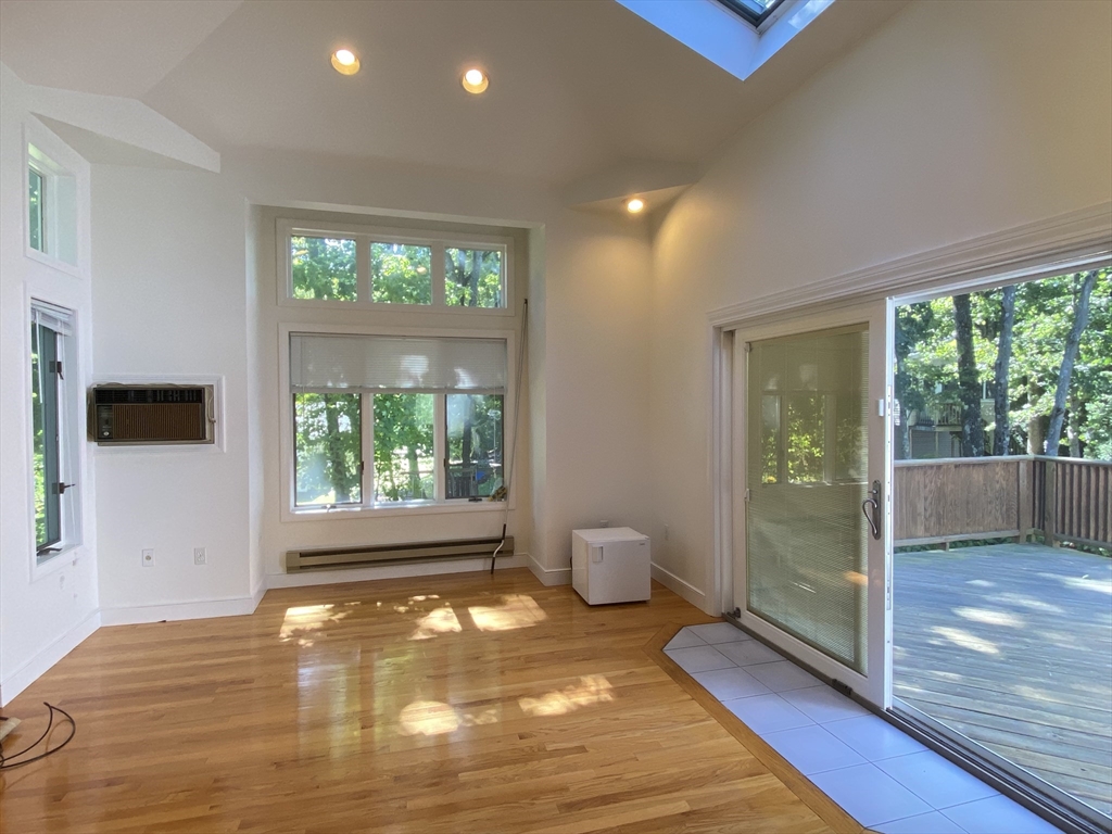 13 Oxbow Road Natick, MA 01760 - Photo 3 of 21 a view of empty room with wooden floor and fan