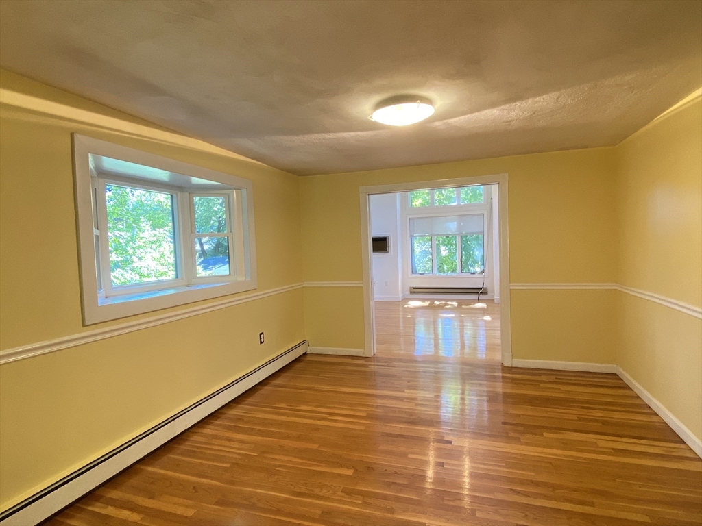 13 Oxbow Road Natick, MA 01760 - Photo 8 of 21 a view of a room with wooden floor and window