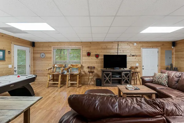a living room with furniture and a flat screen tv