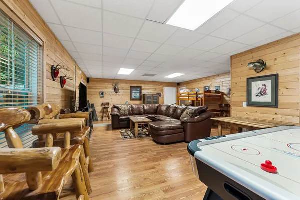 a living room with furniture and a flat screen tv