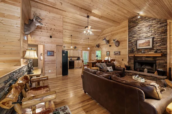 a living room with furniture and a fireplace