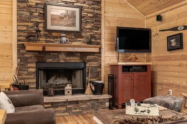 a kitchen with a stove a refrigerator and wooden cabinets