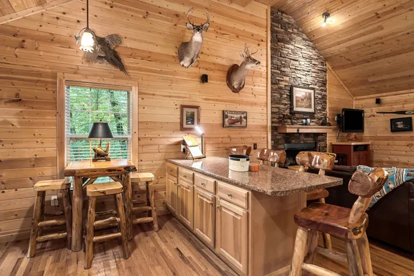 a kitchen with stainless steel appliances granite countertop a sink a stove and a refrigerator