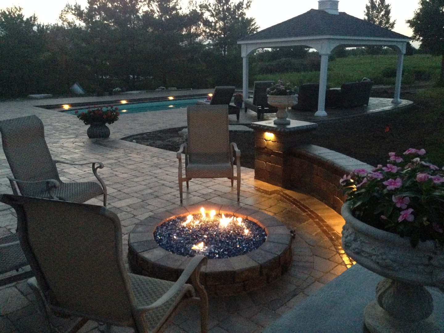 1651 Johnson Road Oswego, IL 60543 - Photo 46 of 60 a view of a patio with table and chairs potted plants with wooden floor