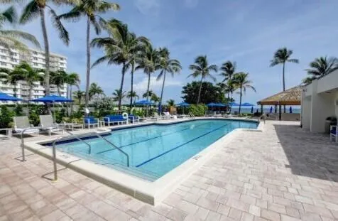 a view of a swimming pool with a patio
