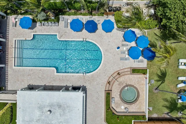a view of a swimming pool with an outdoor seating