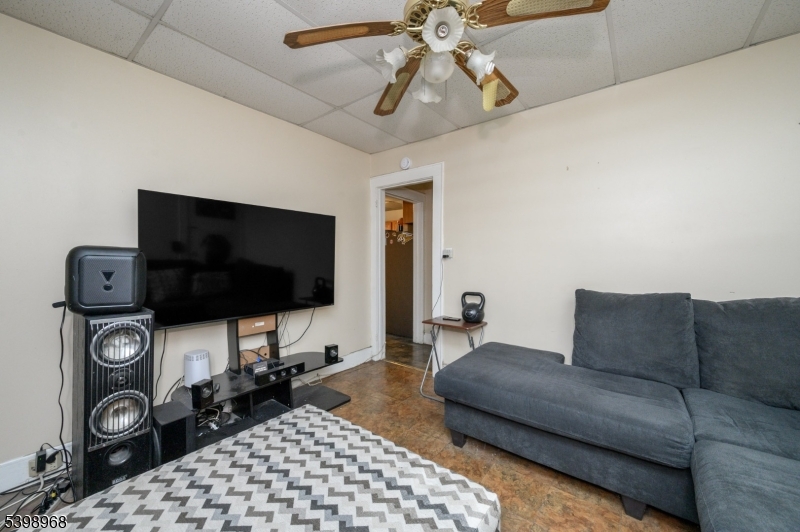 427 North 12th Street Newark, NJ 07107 - Photo 12 of 50 a living room with furniture and a flat screen tv